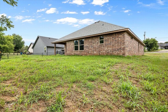 2615 San Gabriel Dr, Granbury, TX 76048 - back of property with brick siding and roof with shingles