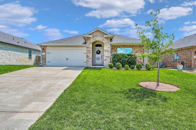 3200 Keathley Dr, Waco, TX 76655 - view of front of home featuring a garage, concrete driveway, a front lawn, brick siding, and roof with shingles