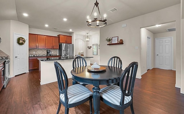 3200 Keathley Dr, Waco, TX 76655 - dining space featuring a chandelier, dark wood-style flooring, recessed lighting, and baseboards