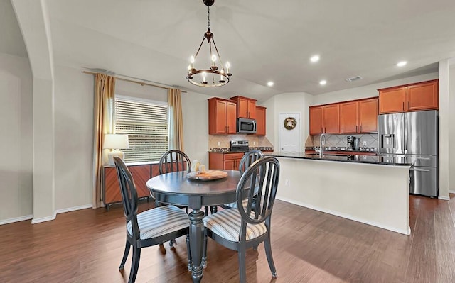 3200 Keathley Dr, Waco, TX 76655 - dining space featuring a chandelier, dark wood-style floors, recessed lighting, baseboards, and vaulted ceiling