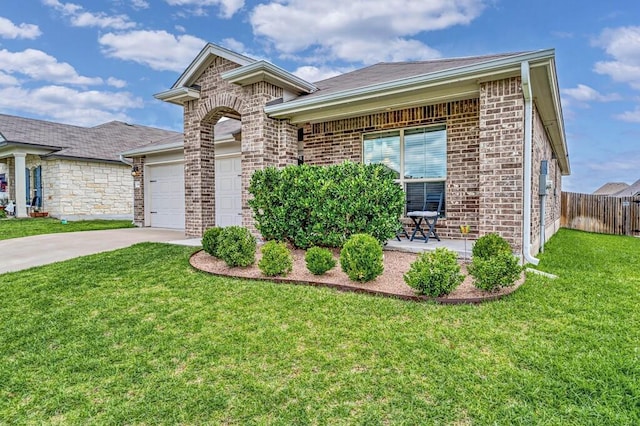 3200 Keathley Dr, Waco, TX 76655 - view of front of house with concrete driveway, an attached garage, and brick siding