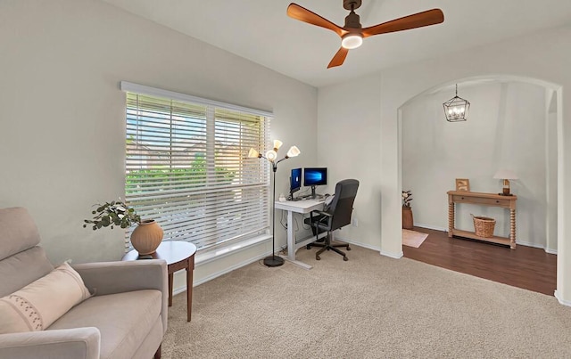 3200 Keathley Dr, Waco, TX 76655 - carpeted home office with arched walkways, a ceiling fan, baseboards, and a chandelier