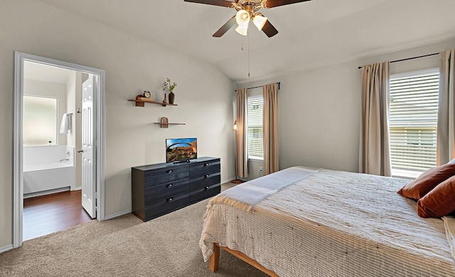 3200 Keathley Dr, Waco, TX 76655 - bedroom with carpet, baseboards, a ceiling fan, vaulted ceiling, and ensuite bathroom