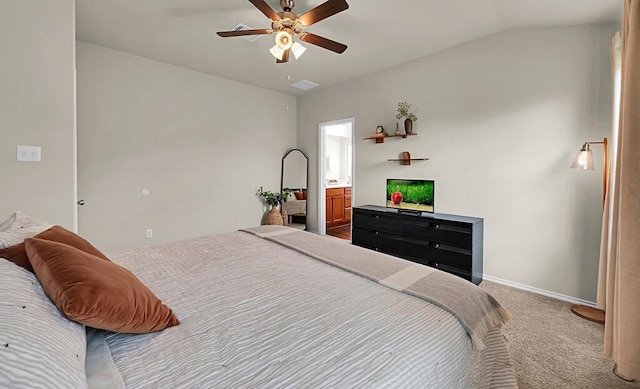 3200 Keathley Dr, Waco, TX 76655 - carpeted bedroom featuring baseboards, vaulted ceiling, ensuite bath, and a ceiling fan