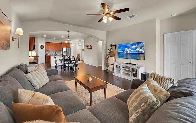 3200 Keathley Dr, Waco, TX 76655 - living area with arched walkways, a ceiling fan, dark wood-type flooring, lofted ceiling, and a chandelier