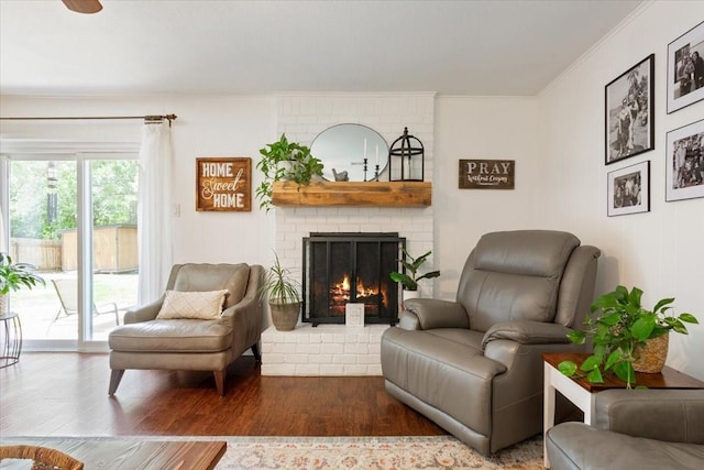 7844 Fairway Rd, Woodway, TX 76712 - living room with ornamental molding, wood finished floors, and a brick fireplace