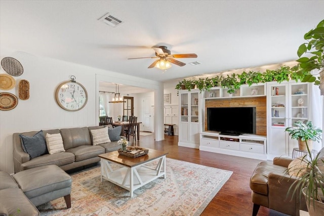 7844 Fairway Rd, Woodway, TX 76712 - living area with a ceiling fan, a chandelier, and wood finished floors