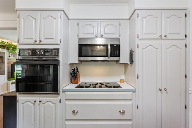 7844 Fairway Rd, Woodway, TX 76712 - kitchen featuring black appliances, light countertops, and white cabinets