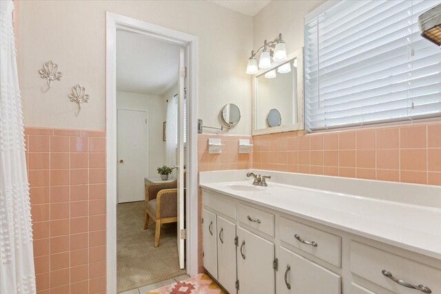 7844 Fairway Rd, Woodway, TX 76712 - full bathroom with tile walls, vanity, and a wainscoted wall