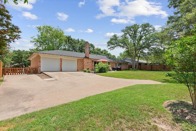 7844 Fairway Rd, Woodway, TX 76712 - view of front of property with brick siding, a garage, a chimney, and concrete driveway