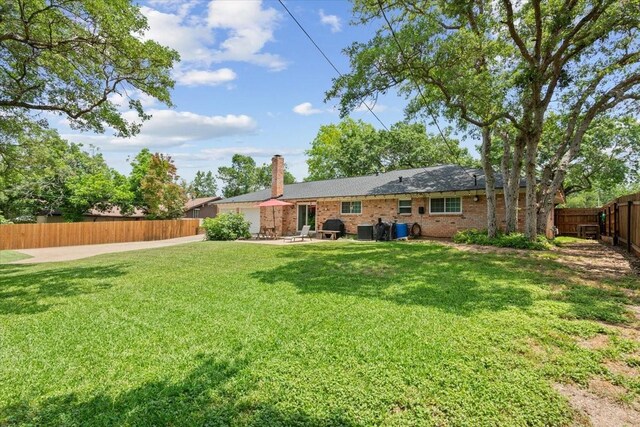 7844 Fairway Rd, Woodway, TX 76712 - back of house featuring a chimney, a patio, and brick siding