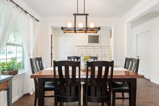 7844 Fairway Rd, Woodway, TX 76712 - dining area featuring a chandelier, dark wood-type flooring, and ornamental molding