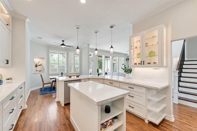 2403 Legend Dr, Heath, TX 75032 - kitchen featuring open shelves, crown molding, a peninsula, a ceiling fan, and stainless steel dishwasher