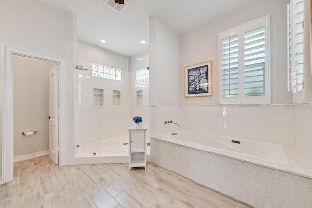 2403 Legend Dr, Heath, TX 75032 - bathroom featuring a garden tub, a shower stall, and recessed lighting