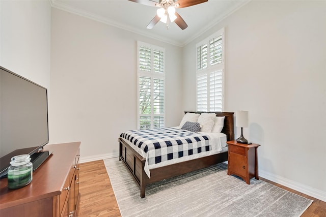 2403 Legend Dr, Heath, TX 75032 - bedroom featuring ornamental molding, light wood-style floors, multiple windows, baseboards, and ceiling fan