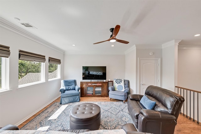 2403 Legend Dr, Heath, TX 75032 - living room with light wood finished floors, ceiling fan, recessed lighting, crown molding, and baseboards