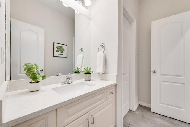2403 Legend Dr, Heath, TX 75032 - bathroom with vanity, baseboards, and marble finish flooring