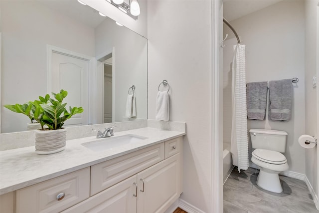 2403 Legend Dr, Heath, TX 75032 - bathroom with vanity, toilet, baseboards, and shower / bath combo