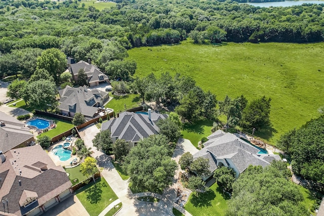 2403 Legend Dr, Heath, TX 75032 - aerial perspective of suburban area with a pool area and a heavily wooded area