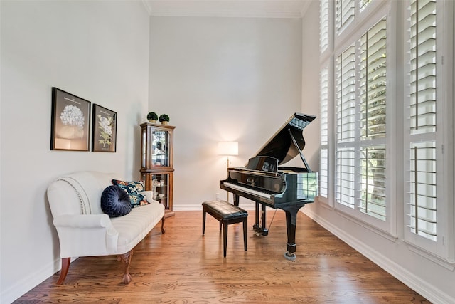 2403 Legend Dr, Heath, TX 75032 - sitting room with baseboards, wood finished floors, ornamental molding, and a towering ceiling