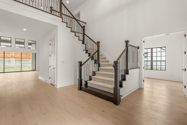 14085 Nicollet Dr, Frisco, TX 75033 - stairway featuring a high ceiling, wood finished floors, baseboards, and recessed lighting