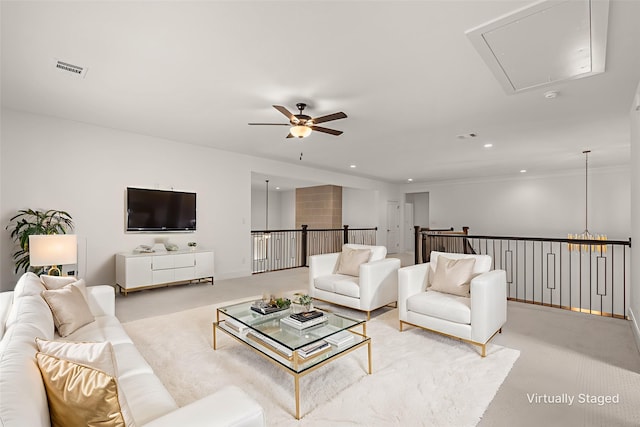 14085 Nicollet Dr, Frisco, TX 75033 - living area with attic access, ceiling fan, recessed lighting, light colored carpet, and crown molding