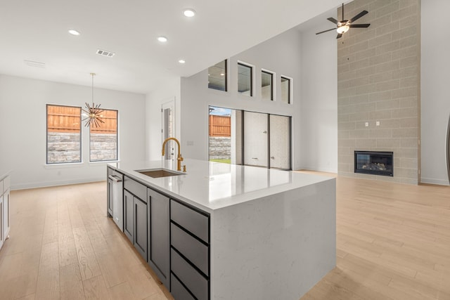 14085 Nicollet Dr, Frisco, TX 75033 - kitchen with a sink, light wood-type flooring, open floor plan, recessed lighting, and ceiling fan