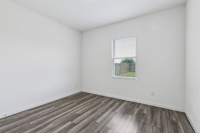 1421 Ancer Way, Fort Worth, TX 76052 - spare room with dark wood-type flooring and baseboards