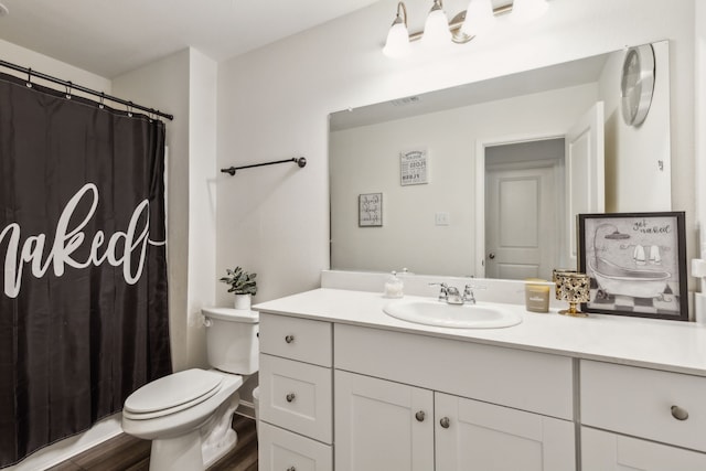 1421 Ancer Way, Fort Worth, TX 76052 - bathroom with vanity, toilet, wood finished floors, and curtained shower