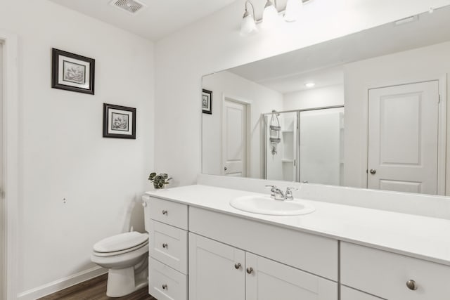 1421 Ancer Way, Fort Worth, TX 76052 - bathroom featuring toilet, vanity, wood finished floors, a shower stall, and baseboards