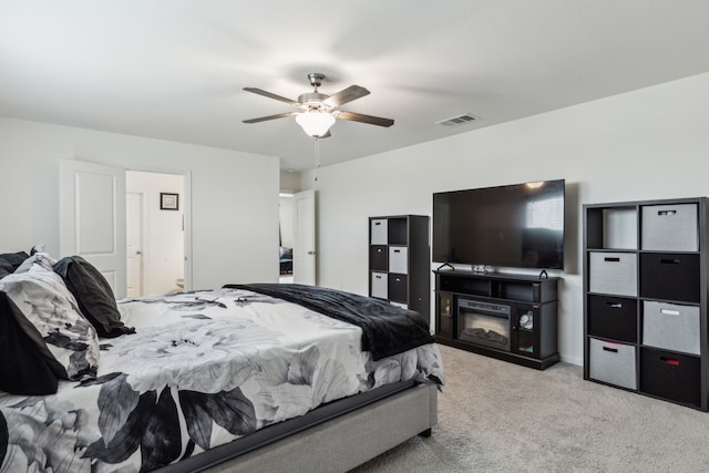 1421 Ancer Way, Fort Worth, TX 76052 - carpeted bedroom featuring a ceiling fan and a glass covered fireplace
