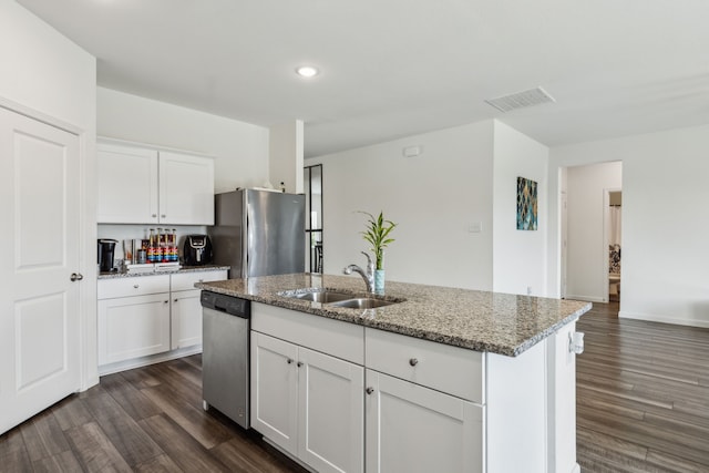 1421 Ancer Way, Fort Worth, TX 76052 - kitchen with appliances with stainless steel finishes, a sink, dark wood-style floors, light stone counters, and white cabinets