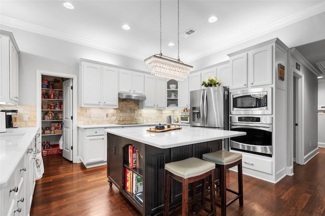 3042 Preston Club Dr, Sherman, TX 75092 - kitchen featuring stainless steel appliances, open shelves, under cabinet range hood, a breakfast bar, and recessed lighting