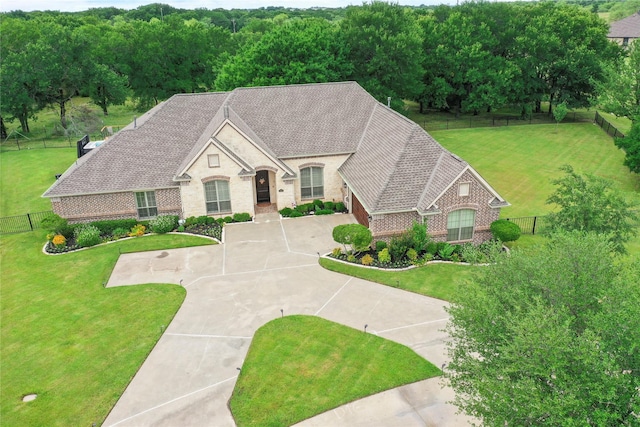 3042 Preston Club Dr, Sherman, TX 75092 - french country home with brick siding, concrete driveway, stone siding, and roof with shingles