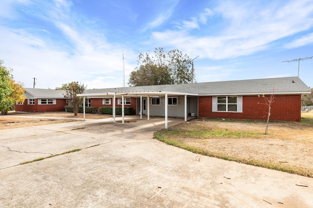 281 Lakeside Dr, China Spring, TX 76633 - ranch-style home featuring driveway, a carport, and brick siding