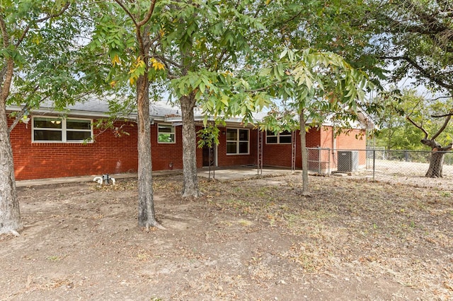 281 Lakeside Dr, China Spring, TX 76633 - view of front of property featuring brick siding, a patio area, and cooling unit