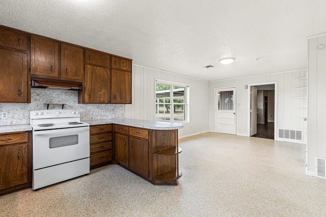 281 Lakeside Dr, China Spring, TX 76633 - kitchen featuring white electric range oven, under cabinet range hood, light countertops, baseboards, and a peninsula