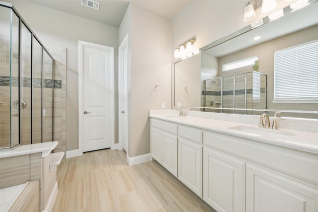 2608 Morning Mist Ln, Nevada, TX 75173 - full bath featuring double vanity, a shower stall, and baseboards