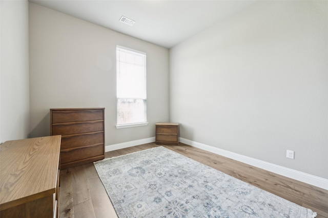 2608 Morning Mist Ln, Nevada, TX 75173 - bedroom featuring multiple windows, wood finished floors, and baseboards