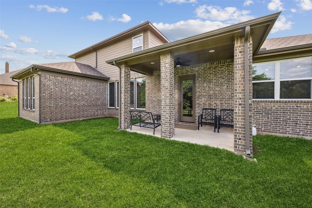 2608 Morning Mist Ln, Nevada, TX 75173 - rear view of house featuring brick siding, a yard, a patio area, and ceiling fan