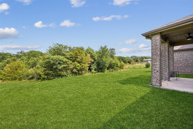 2608 Morning Mist Ln, Nevada, TX 75173 - view of green lawn with a patio area and a ceiling fan