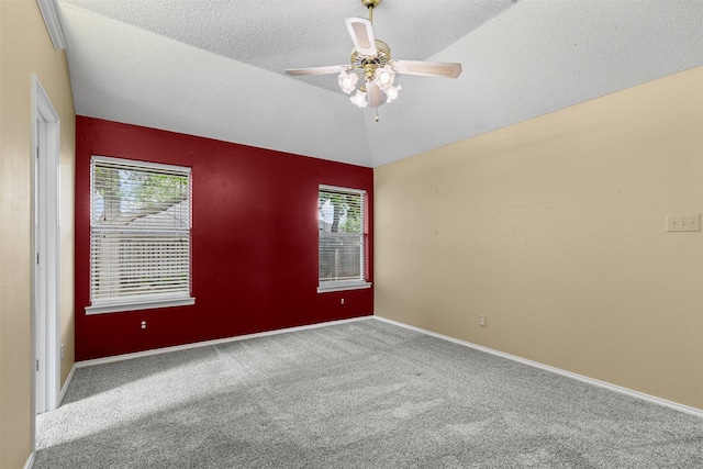 1505 Hyde Park Blvd, Cleburne, TX 76033 - carpeted spare room featuring lofted ceiling, plenty of natural light, ceiling fan, a textured ceiling, and baseboards