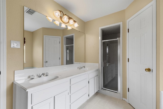 1505 Hyde Park Blvd, Cleburne, TX 76033 - full bath featuring double vanity, a stall shower, and tile patterned flooring