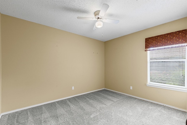 1505 Hyde Park Blvd, Cleburne, TX 76033 - unfurnished room with carpet floors, plenty of natural light, ceiling fan, baseboards, and a textured ceiling