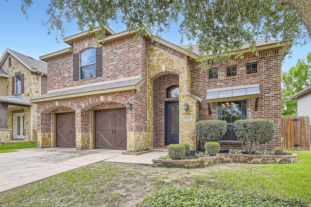 9028 Wiggins Dr, Fort Worth, TX 76244 - view of front of property featuring an attached garage, driveway, brick siding, and stone siding