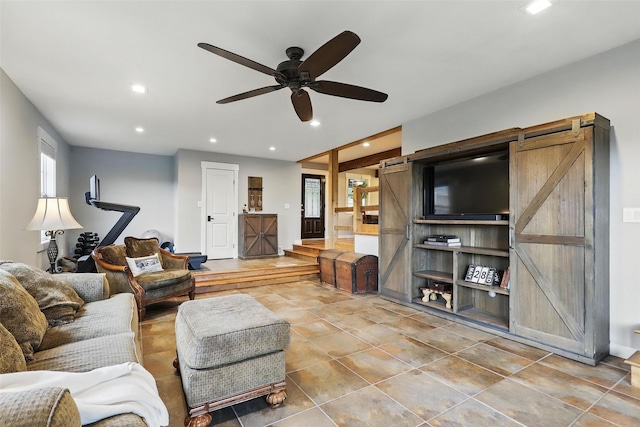 4009 Seminole Trl, Granbury, TX 76048 - living area with a barn door, recessed lighting, ceiling fan, and tile patterned floors