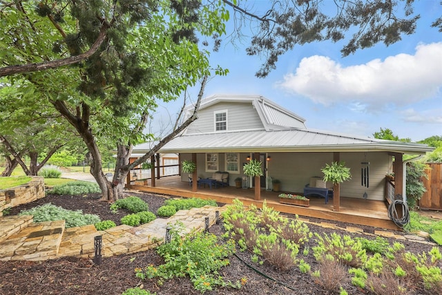 4009 Seminole Trl, Granbury, TX 76048 - view of front facade featuring metal roof and covered porch