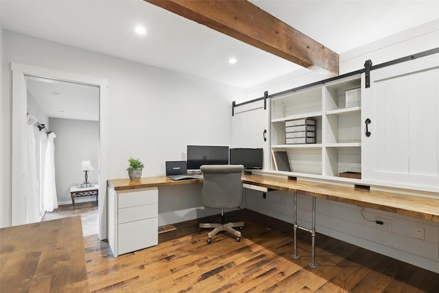 4009 Seminole Trl, Granbury, TX 76048 - office space with a barn door, wood finished floors, beam ceiling, built in desk, and recessed lighting