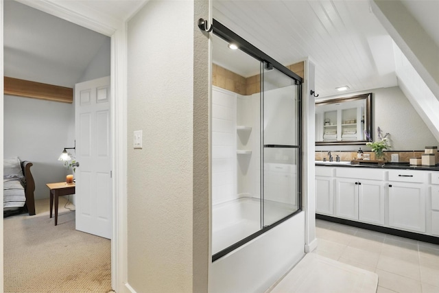 4009 Seminole Trl, Granbury, TX 76048 - bathroom with vanity, a textured wall, and shower / bath combination with glass door