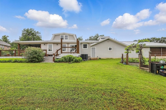 4009 Seminole Trl, Granbury, TX 76048 - rear view of property with central AC unit, a vegetable garden, a lawn, and a wooden deck